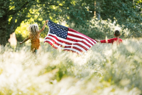 children holding the American flag